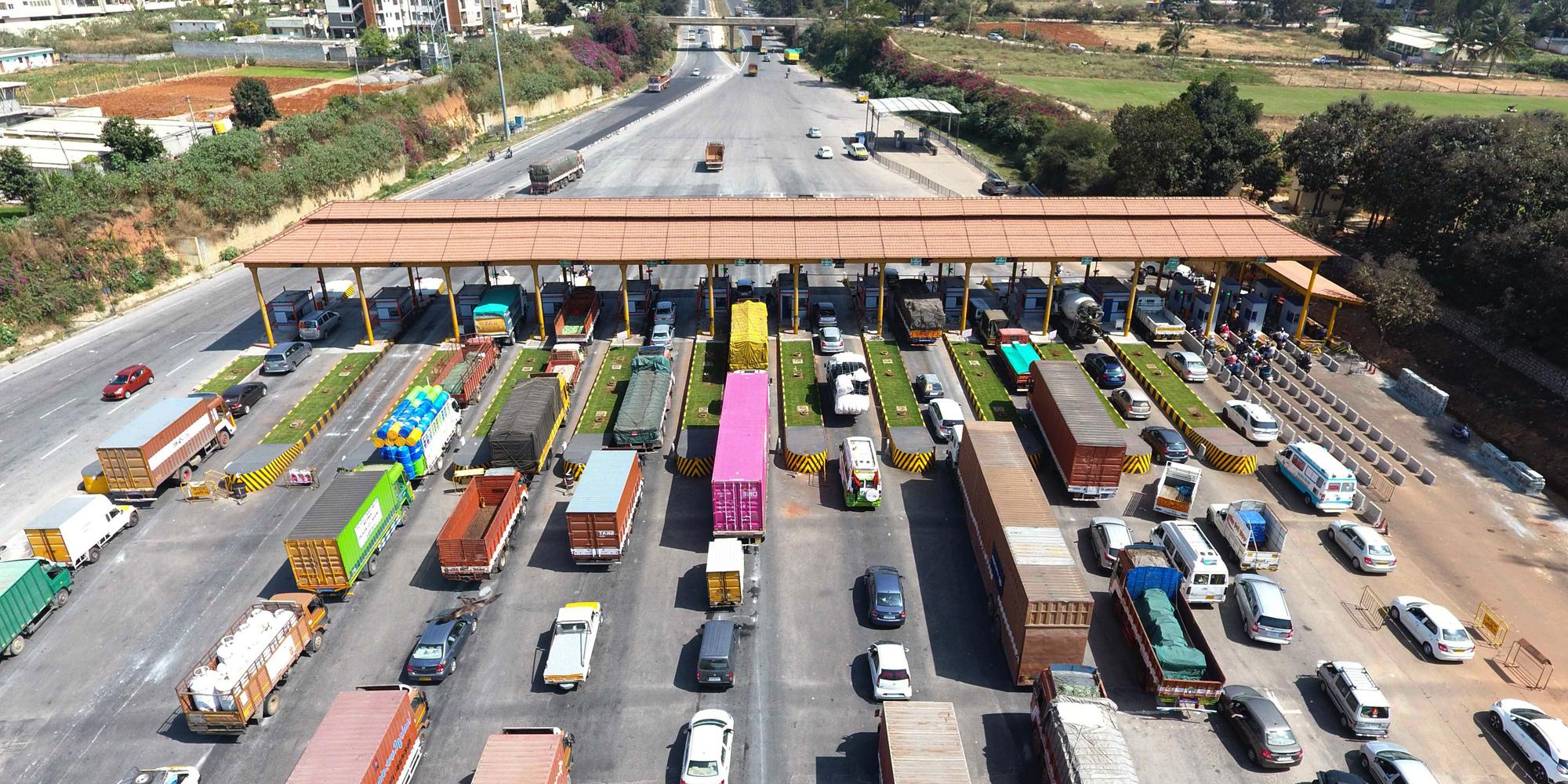 Cars and trucks lined up at NECE toll station